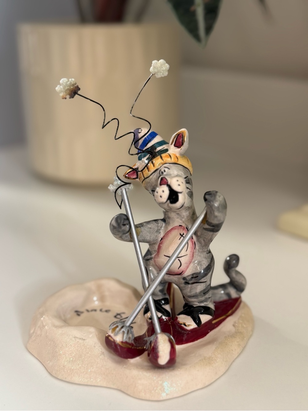 Blue Sky Heather Goldminc Ceramic Cat Skiing Figurine - Cream Base, Red Accents